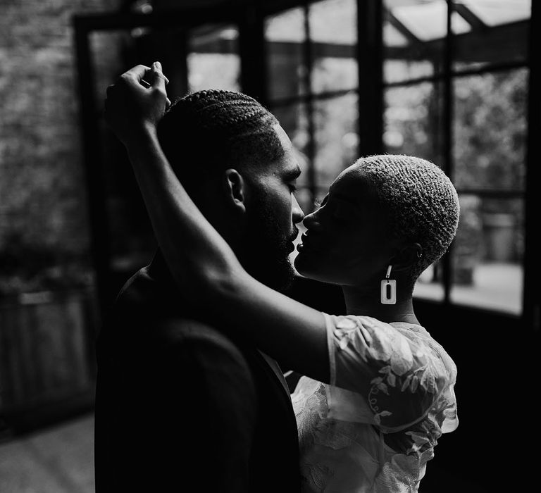 Black Bride and Groom share a kiss at London Wedding Venue, 100 Barrington