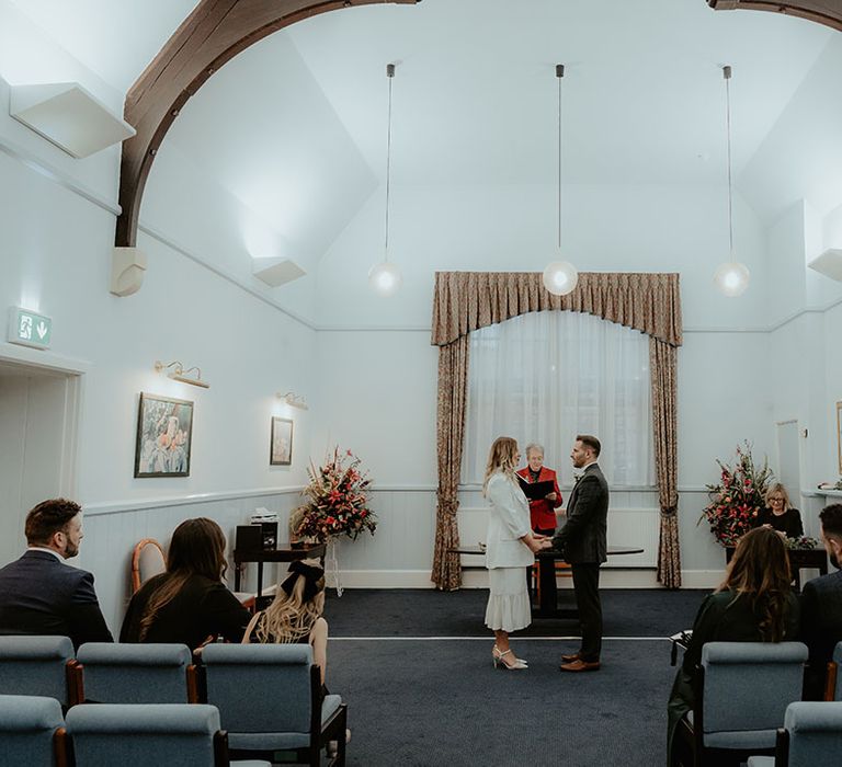 Stroud Registry Office micro wedding with the bride and groom participating in the ceremony and the small wedding party watching on