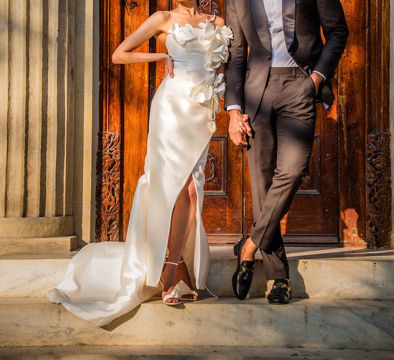 Black tie wedding fashion with the groom in a black tux and the bride in a custom Milla Nova wedding dress 