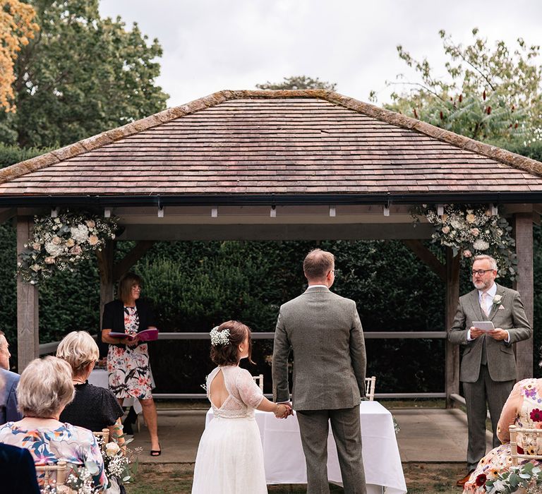 Outdoor wedding ceremony at Langshott Manor in Horley, Surrey 