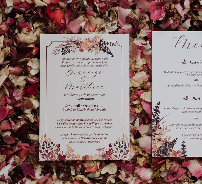 Wedding stationery on a bed of petals 