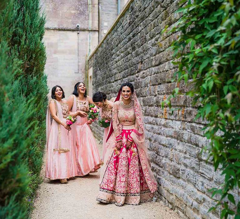 Bride with bridesmaids in pink dresses