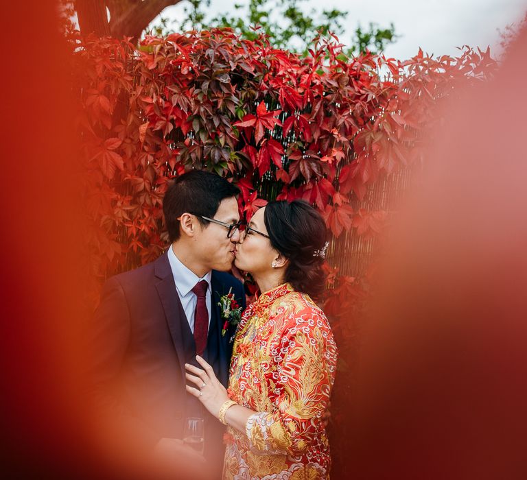 Bride & groom kiss on wedding day