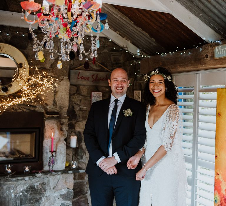 Bride & groom smile after wedding ceremony at the Lower Barns in Cornwall