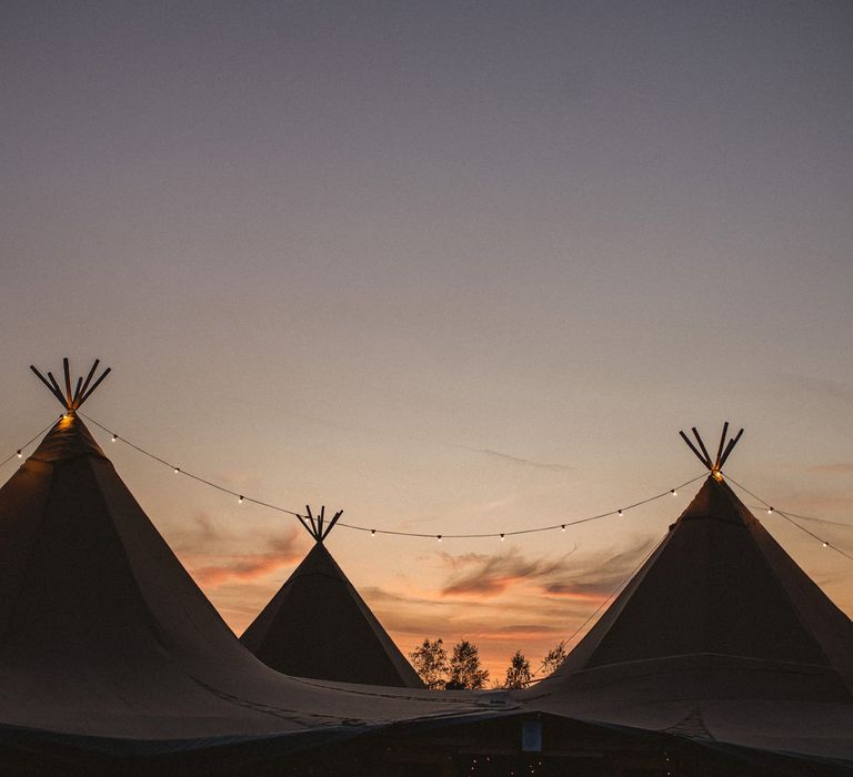 Tipi wedding venue during sunset at Inkersall Grange Farm