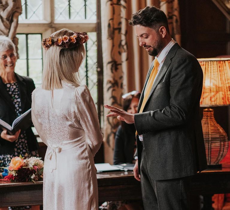 Bride and groom during civil ceremony at Hellens Manor wedding 