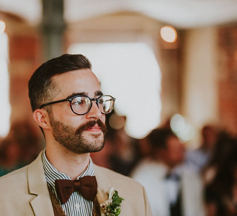 Groom waits for his bride on the day of his wedding