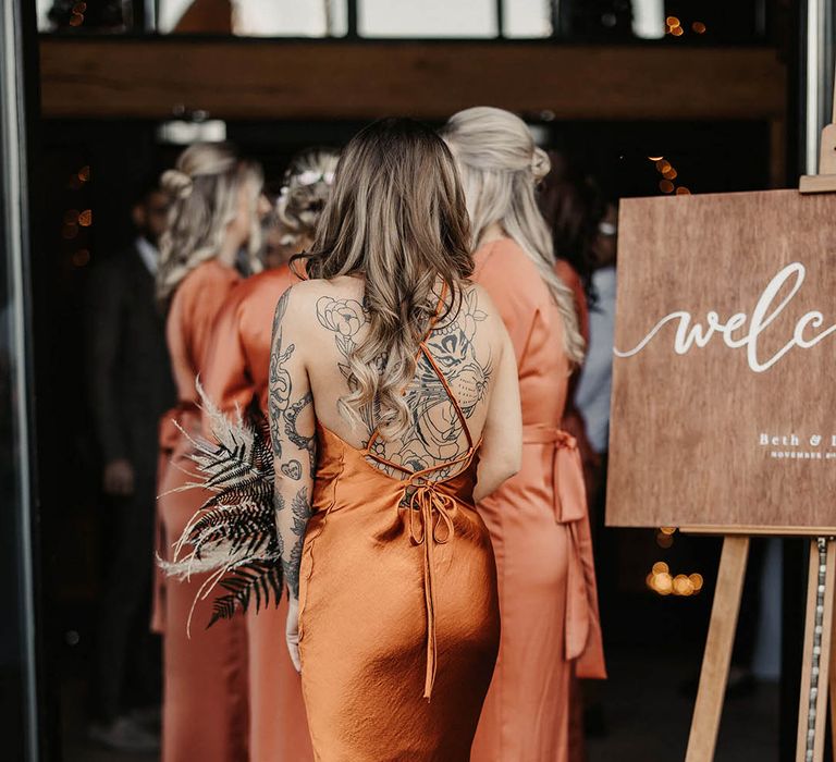 Crossover back burnt orange bridesmaid dress