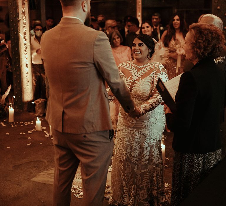 Wedding ceremony at Victoria Warehouse in Manchester with boho bride in a lace wedding dress