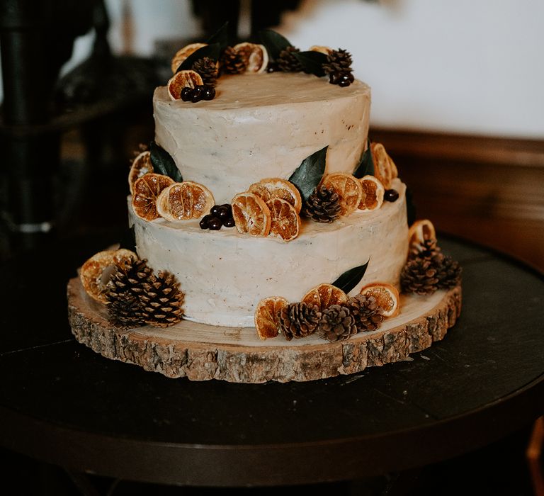 Rustic wedding cake complete with fruit decor