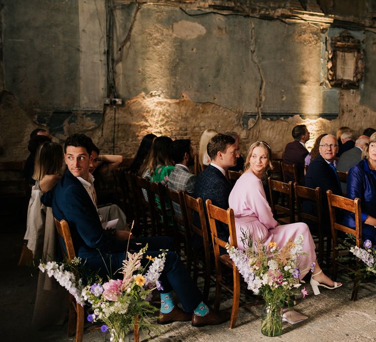 Wedding guests turn to get first look at the bride 