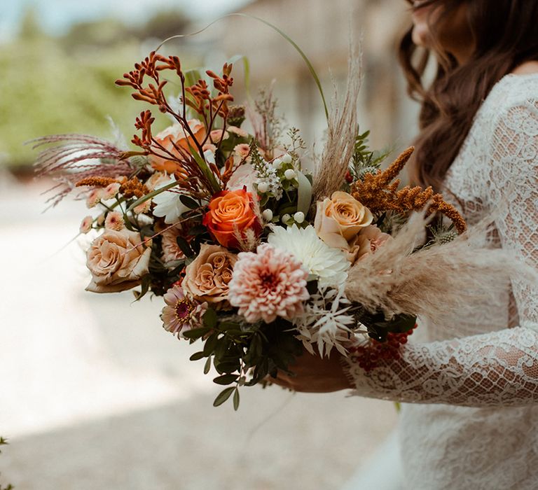 Peach, toffee, rust, red and white wedding bouquet for autumnal wedding 