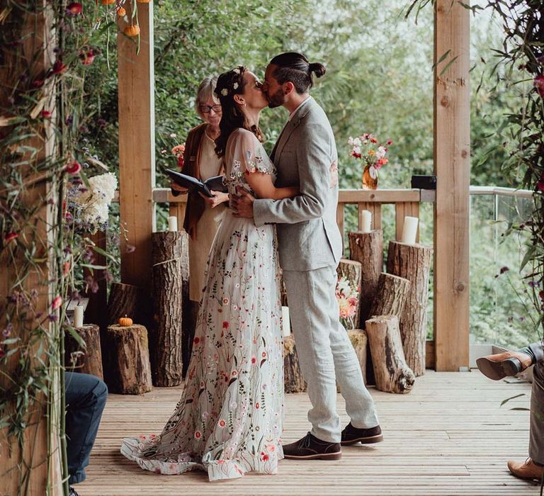 Bride and groom have their first kiss as a married couple 