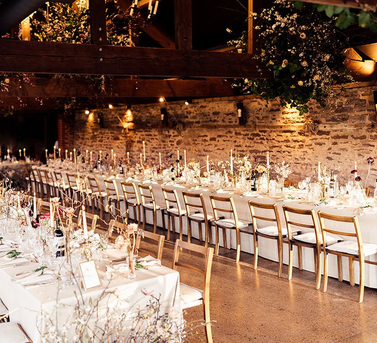 Flower cloud decoration at classic style wedding with white table settings with white candles