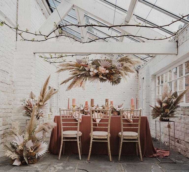 Wedding flower arrangements, installation and table decor with preserved pastel flowers and dried grasses at Garthmyl Hall 