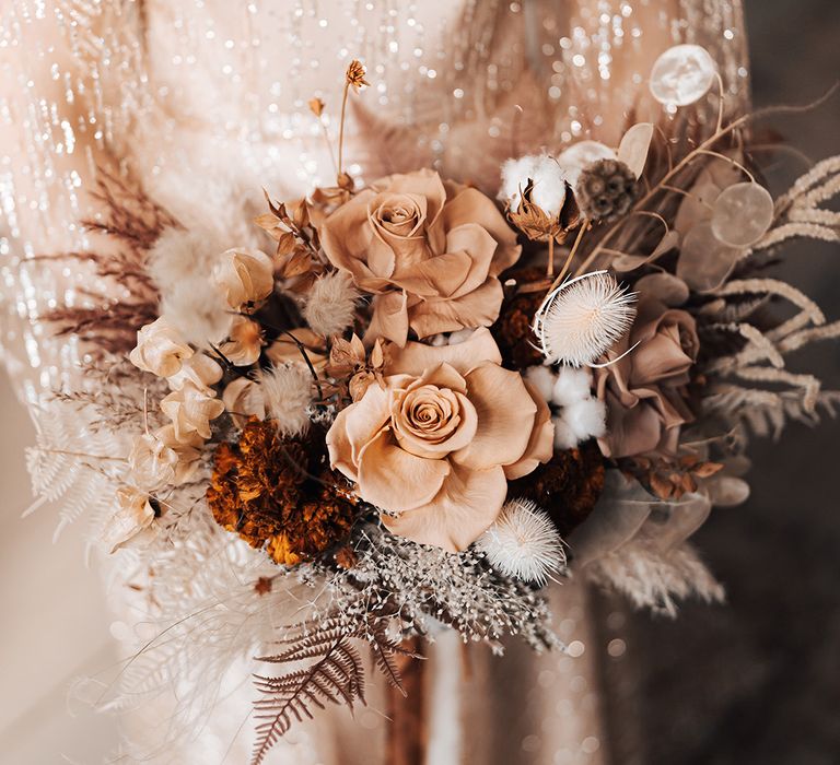 Dried floral wedding bouquet complete with Autumnal tones and boho style