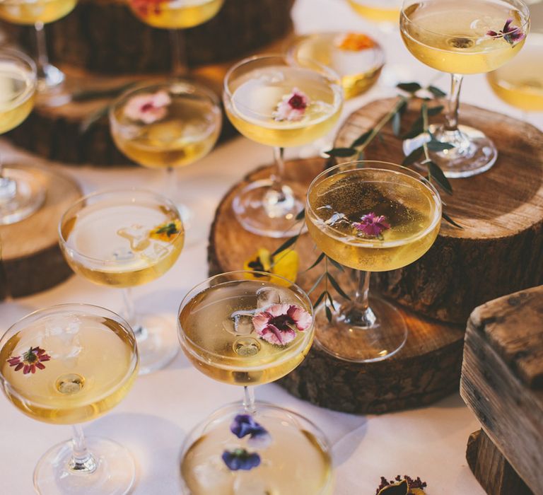 Mocktails in coupe glasses with edible flowers  