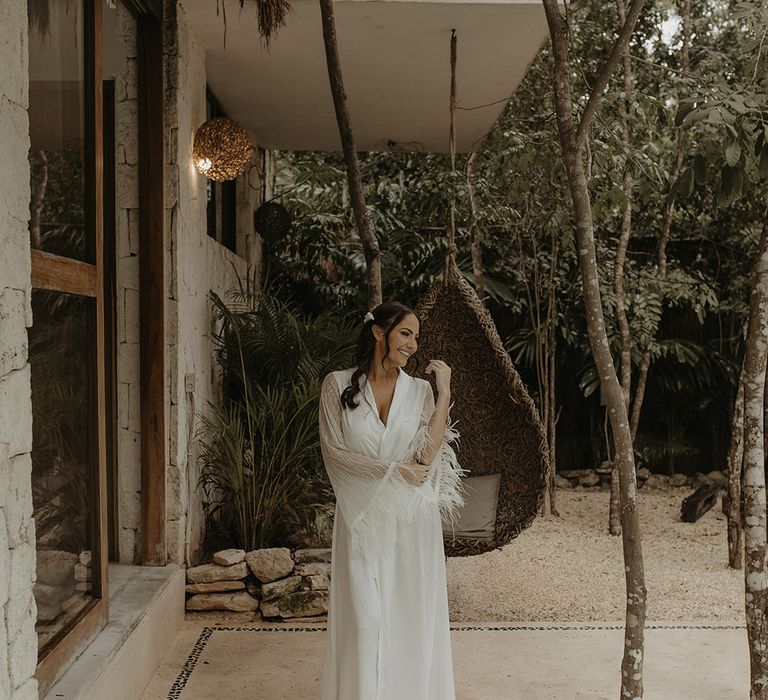 Bride wears feathered dressing gown on the morning of her wedding day