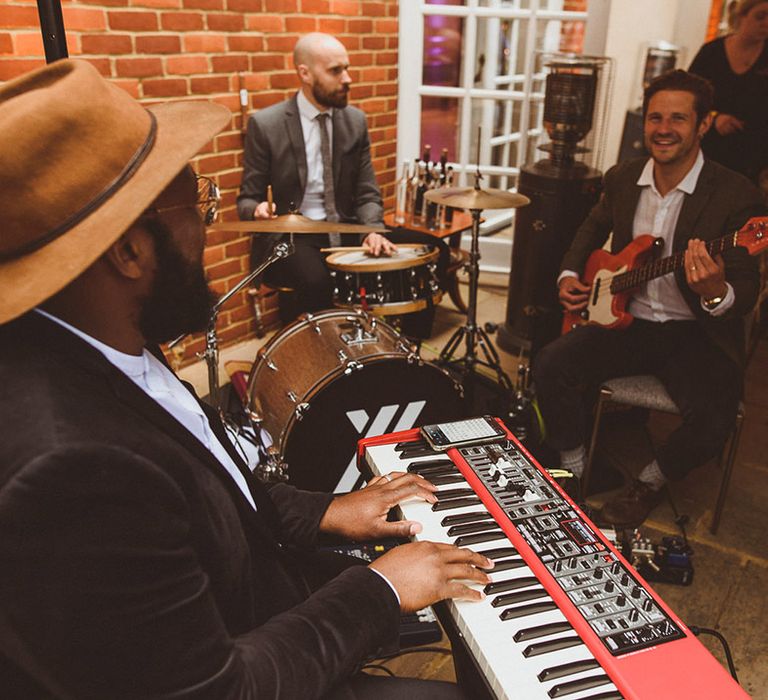 Wedding band plays at the marquee wedding reception 