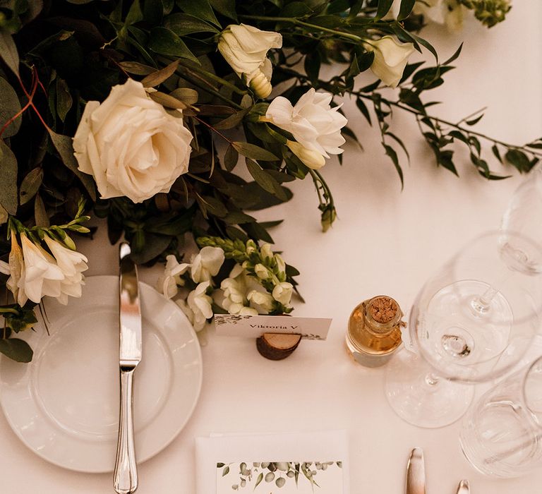 wedding place setting with menu card with green foliage design 