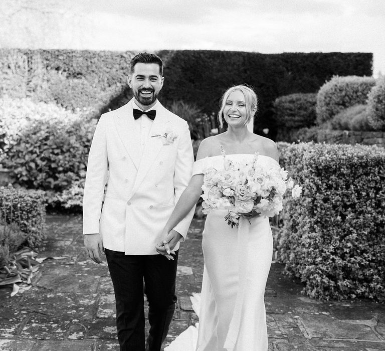 Black and white wedding photo of the bride and groom at their classic country house wedding 