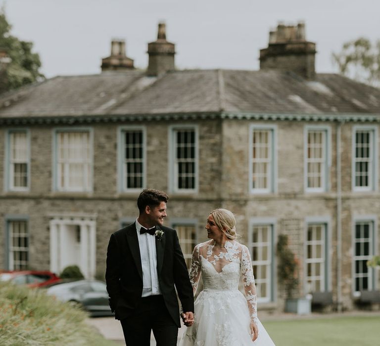 The bride and groom pose for their couple portraits at Silverholme Manor 