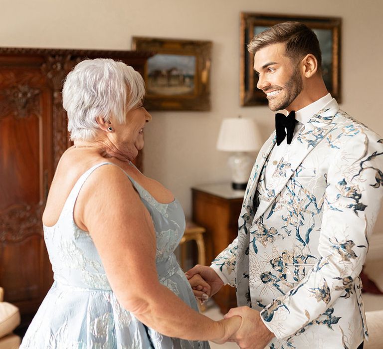 Groom with mother of the groom as they get ready for the wedding 