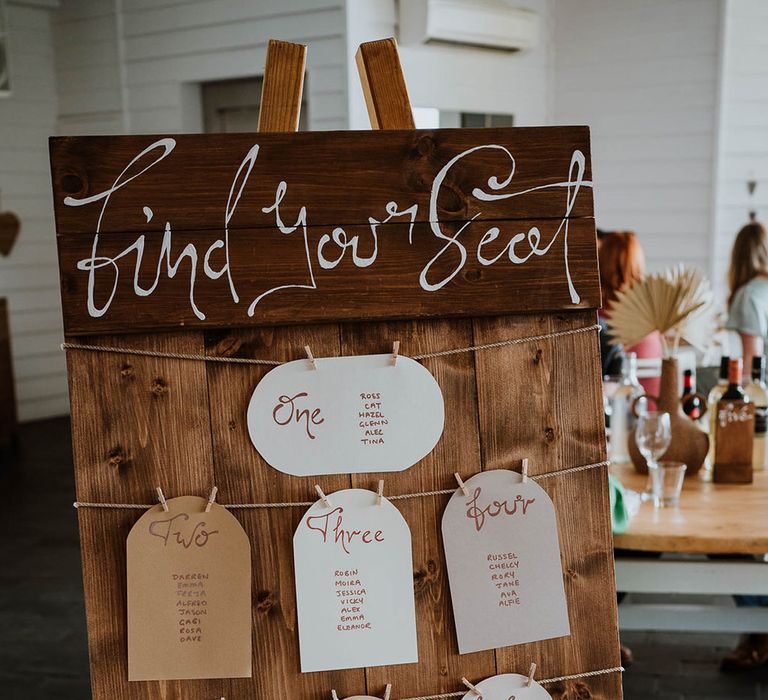 Wooden rustic wedding table plan signage made by the bride 