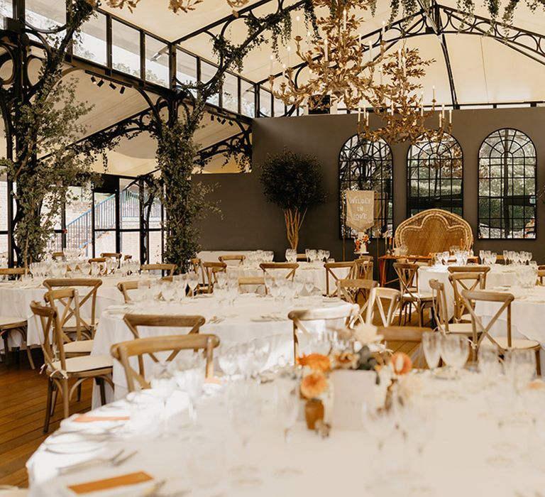 Port Lympne wedding venue with tables set up for boho safari wedding with foliage and neutral earthy tones 