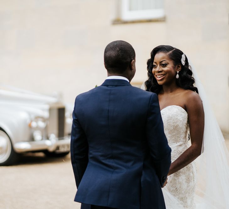 Bride and groom holding hands at Syon Park 