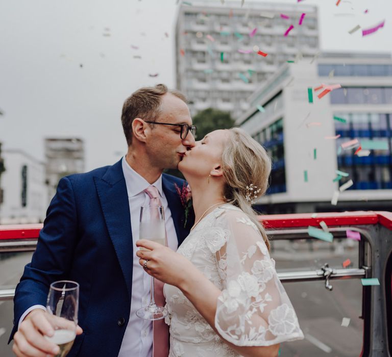 Bride and groom steal a kiss