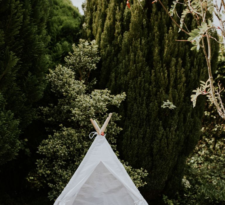 Tipi and bride and groom bears for wedding reception at home 