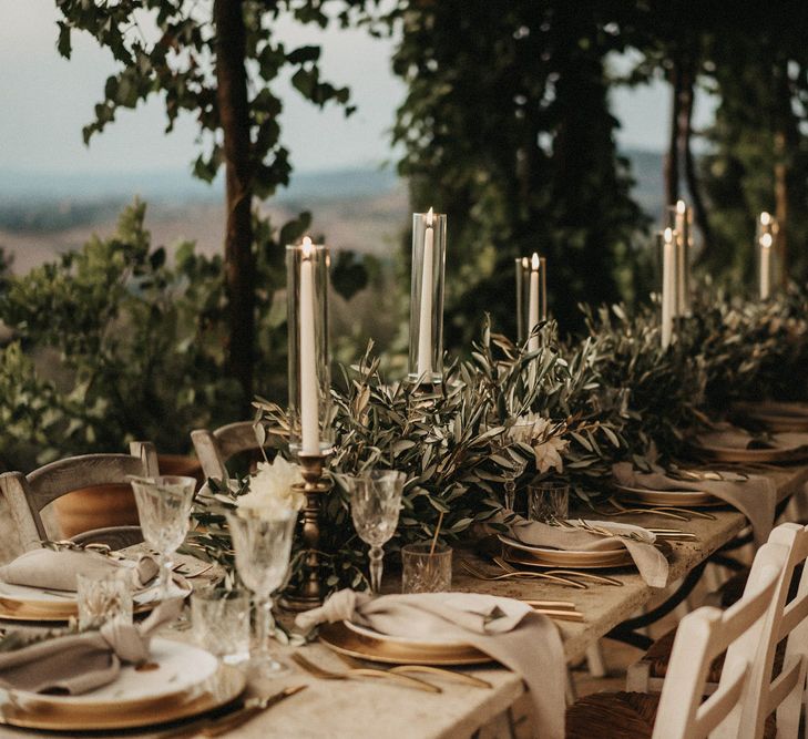 Olive branches line the tablescape in Tuscany