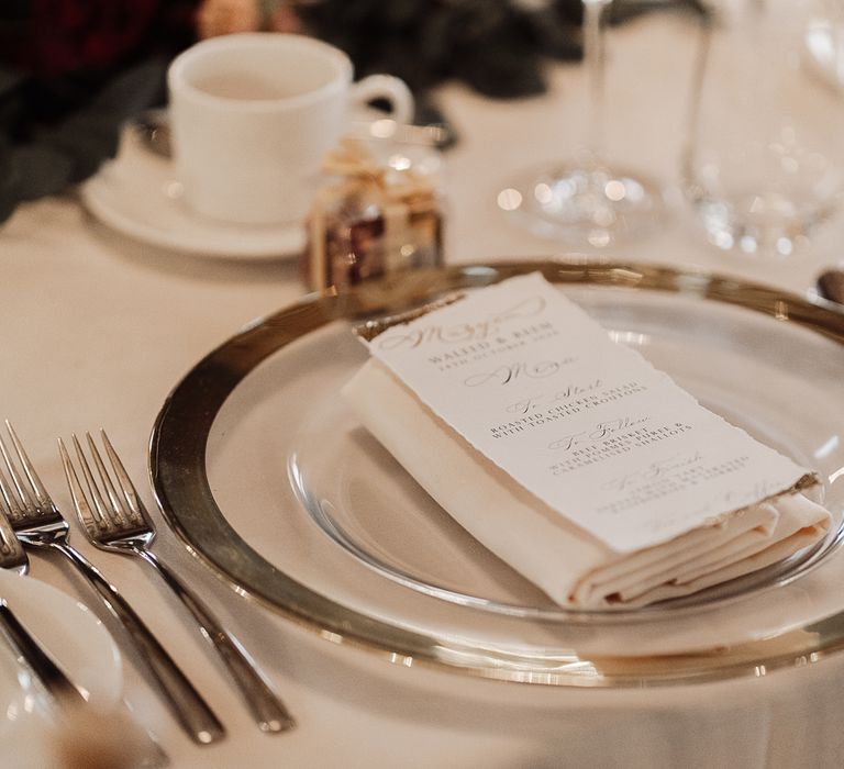 Clear charger plate with gold rim at intimate micro wedding 