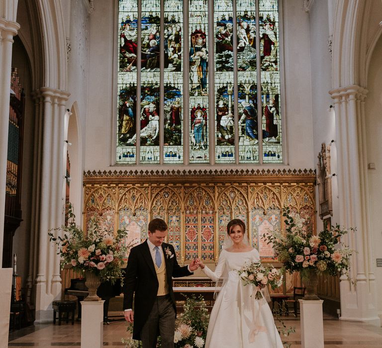 Stunning London Church wedding with stained glass colorful windows