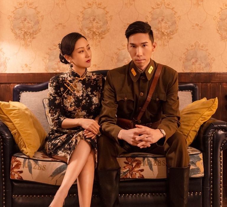 Chinese couple pose in traditional 1920s Chinese western era clothing