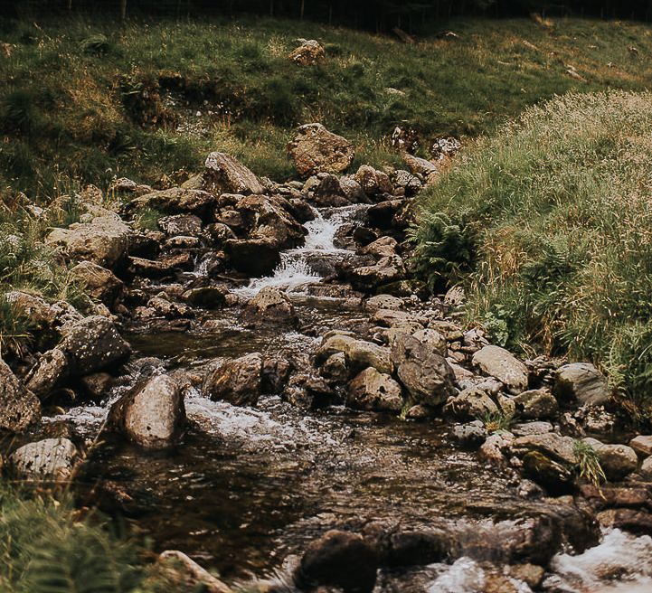 Water cascades down rocks in the Lake District 