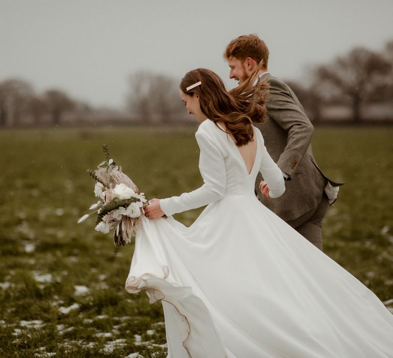 Walking through the fields of the groom's family farm