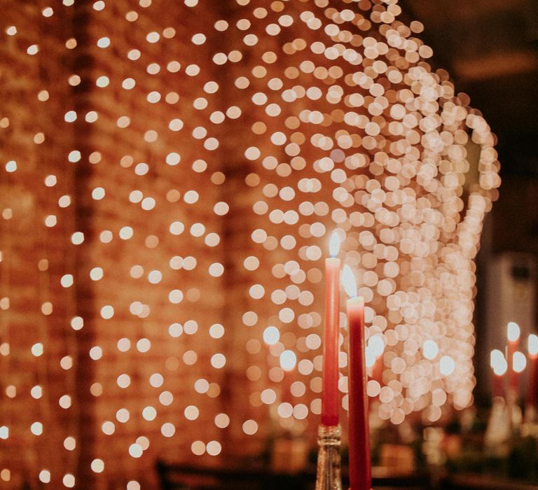 Brown box wedding favours, pine tree centrepieces and a wall of waterfall fairy lights at Block 33