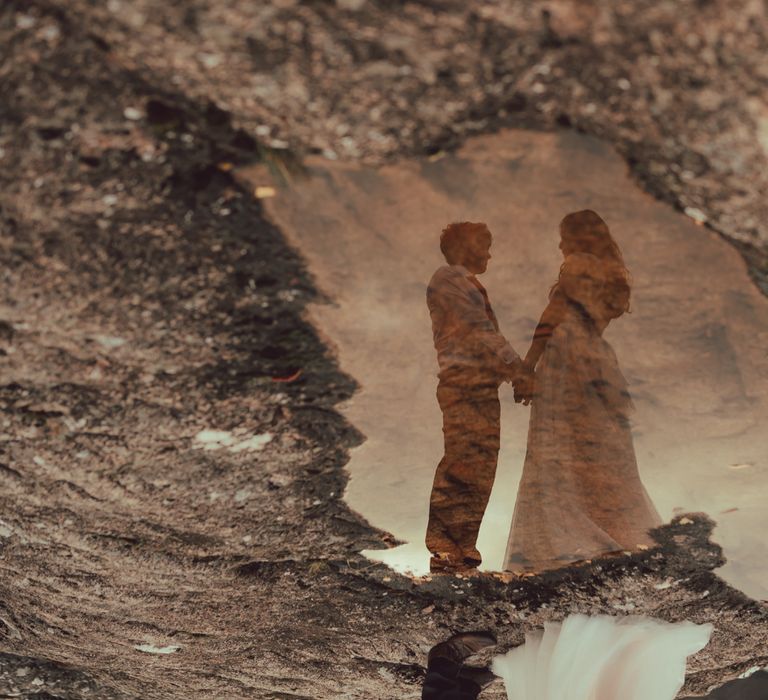 Reflection of couple in water 