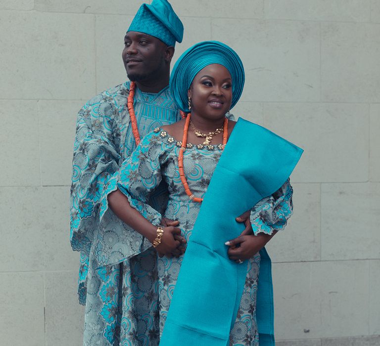 Bride & groom wear traditional West African wedding outfits