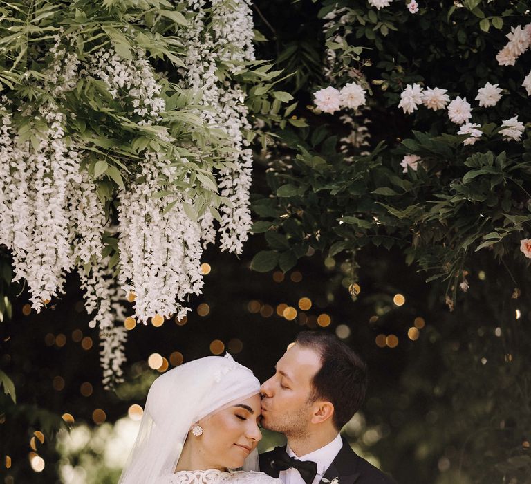 Bride in high neck and long sleeve lace wedding dress