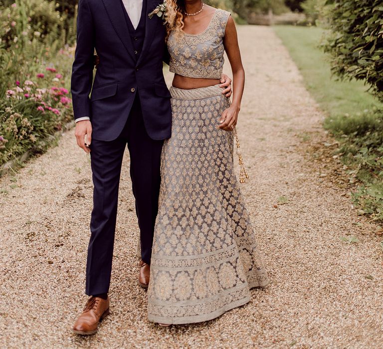 Bride & groom stand with one another outdoors on their wedding day at Gaynes park | Joshua Gooding Photography