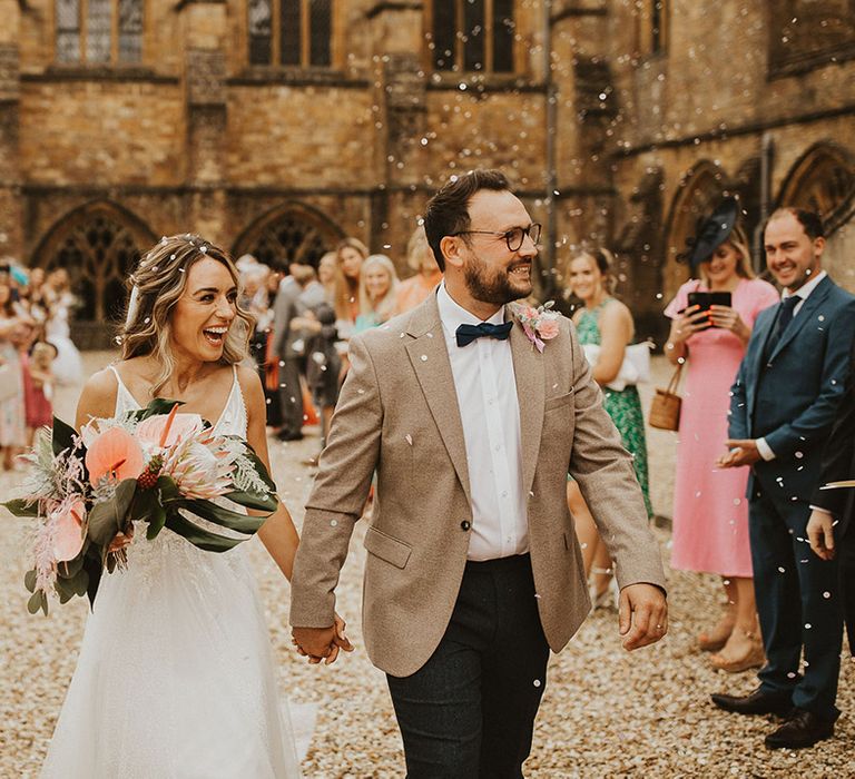 Bride & groom walk with one another on their wedding day