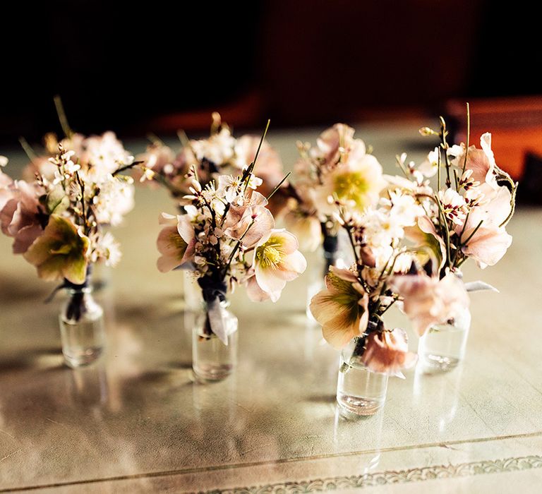 Pink flower buttonholes for groom and groomsmen