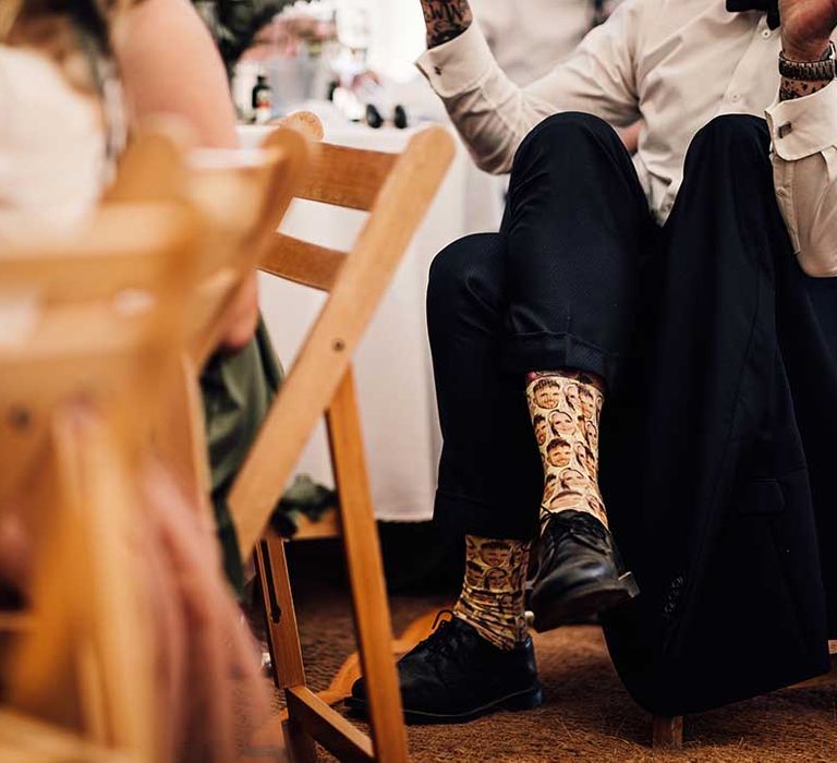 Groomsmen with personalised socks of the bride and groom's faces 