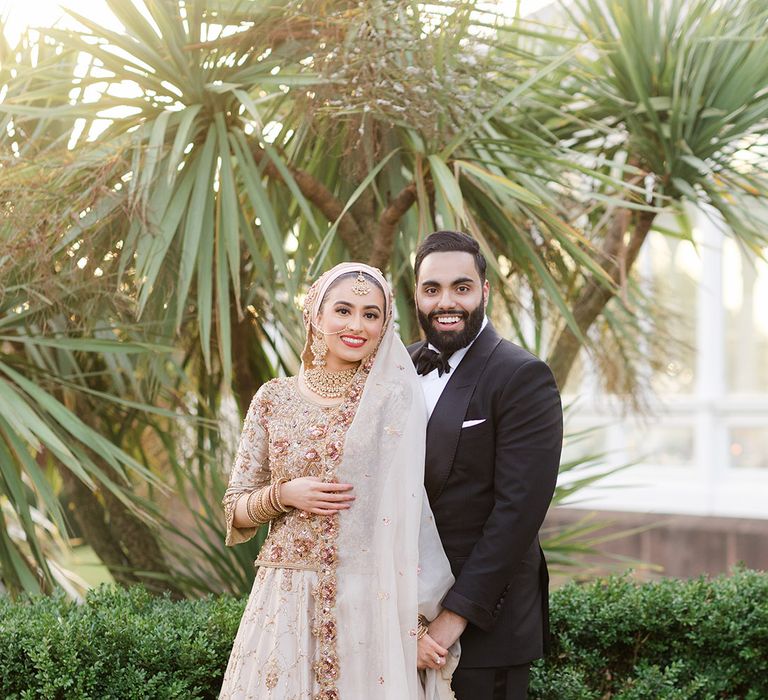 Bride & groom pose for couples portraits after Walima & Nikkah ceremony 