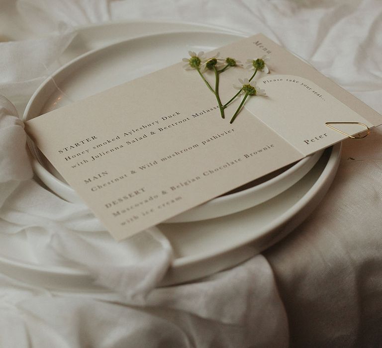 Monochrome wedding tablescape with minimalistic off white wedding dinner menu and daisies 