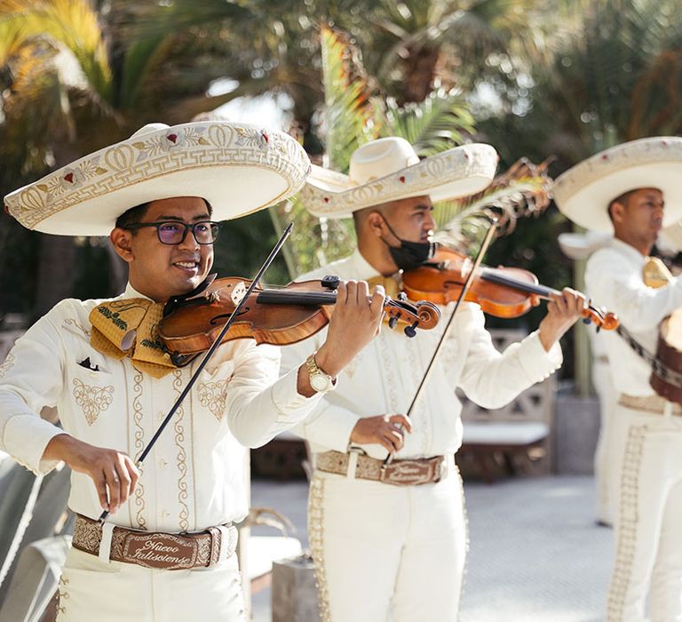 Mariachi band play outdoors after wedding ceremony in Mexico 