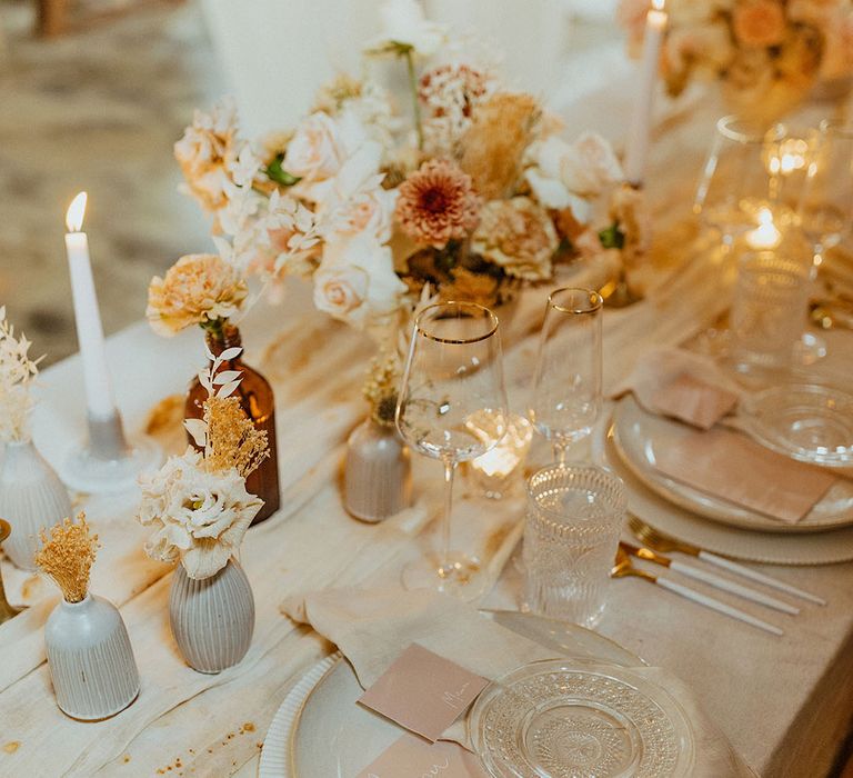 white and glass tableware, blush pink stationery, candles and neutral wedding flowers wedding table decor 